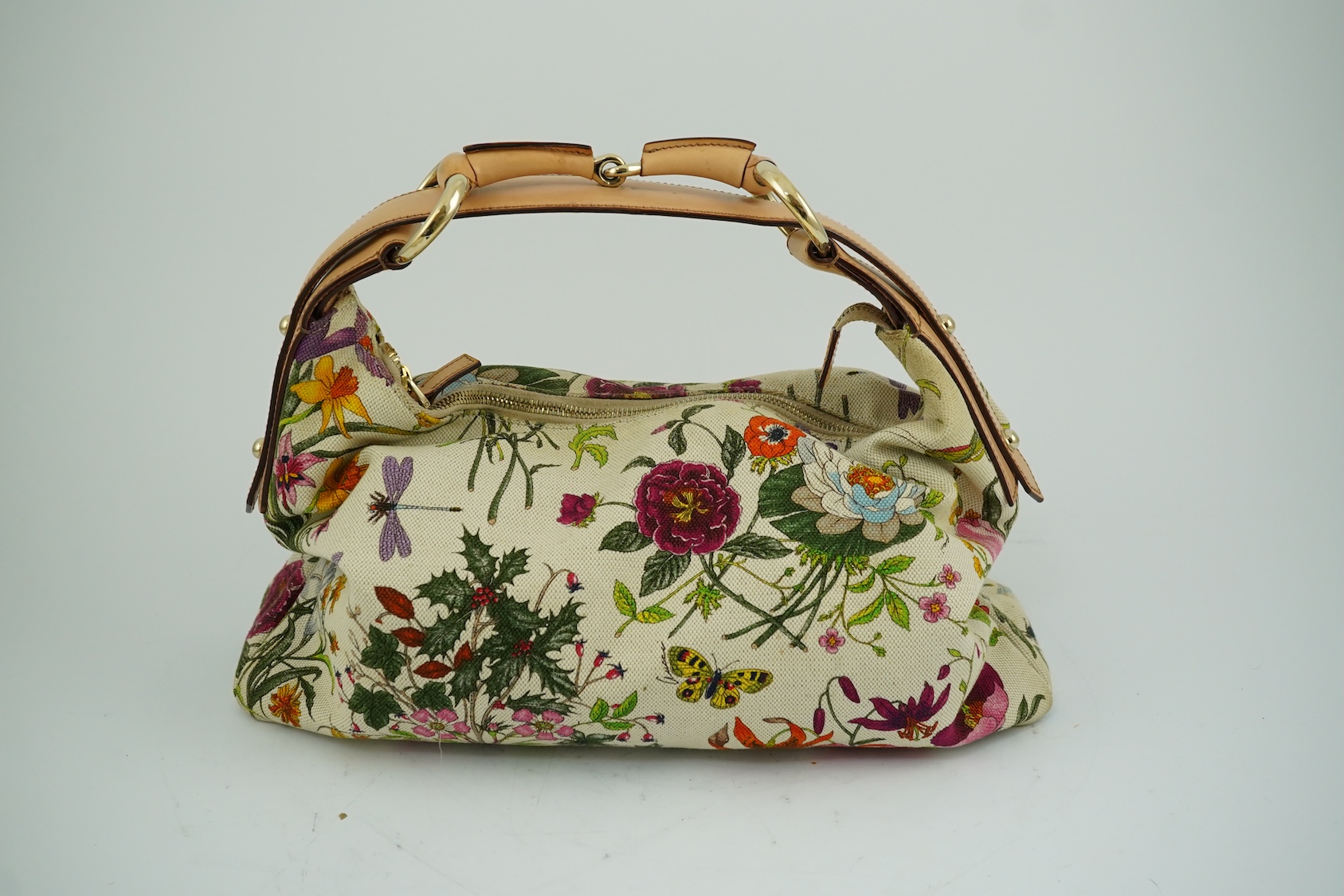 A Gucci flora canvas horse-bit hobo bag with dust bag